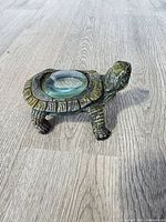 Top view of resin turtle with inset magnifying lens
