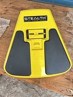 Top view of yellow Stealth core trainer showing smartphone cradle and black pads