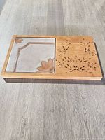 Full view of the charcuterie board showing wood section and ceramic tile inlay