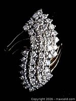 Close-up of diamond marquise cluster showing stone layout and setting