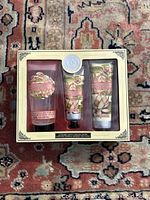 Front view of boxed Aromas Artesanales de Antigua Lotus Flower gift set showing three tubes