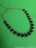 Full view of necklace showing crystals, settings and clasp
