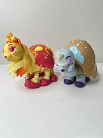 Front view of both Keypers figures