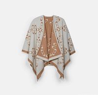 Poncho draped to show chalk side with taupe trim and signature pattern
