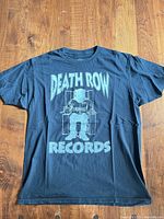 Front of black Death Row Records T-shirt with graphic