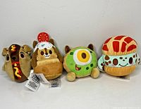 All four Disney Munchlings plush standing side by side