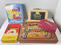 Front view of all five boxed games