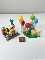 Full lot: Russell minifigure on grey plate with accessories and balloon/fence build with book