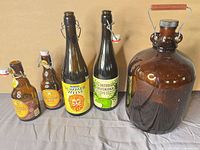 Group shot of five amber bottles