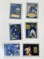 Front view of all six Curtis Joseph Maple Leafs cards in sleeves