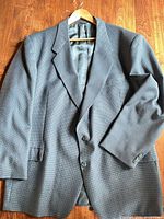 Full front view of grey Tailor Craft blazer on hanger