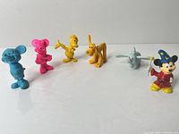 Group shot of all six Disney figures in a row