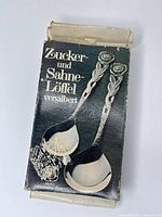 Front of original box showing product image and German text