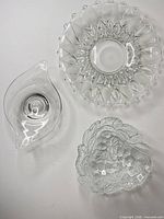 Three clear glass pieces grouped together