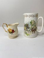 Front view of pitcher and creamer showing patterns and size relation