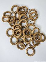 Pile of wooden rings showing quantity and overall appearance