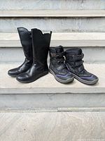 Both pairs of boots side by side front view
