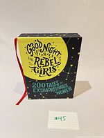 Slipcase front with title and ribbon