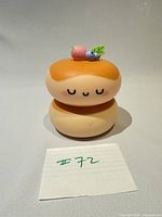 Front view of squishy donut night light showing facial features and overall condition
