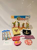 Group shot of craft kit, paper strips, pouches, decorative box