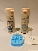 Front view of two Cinnamoroll bottles and silicone mold