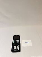Front view of TI-84 Plus CE calculator with slide cover underneath