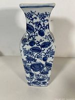 full frontal view of square blue and white porcelain vase