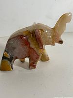 Side view of carved onyx elephant figurine
