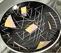 Entire plate showing full geometric design and white rim