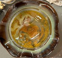 Top view of large amber glass bowl showing wavy rim