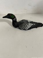 Profile view of loon figurine showing detailed paintwork