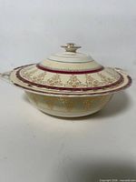 Side view of covered vegetable bowl showing profile and lid