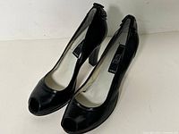 pair of black Sergio Rossi peep-toe pumps side view