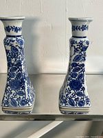 Front view of both porcelain candlesticks