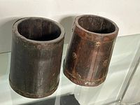 Two wooden barrels side by side showing overall form