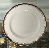Front of plate showing cobalt rim and gold trim