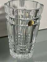 Full view of vase showing fluted panels and label