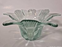 Overall view of green glass flower-petal dish