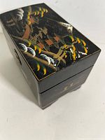 closed jewelry box showing painted landscape