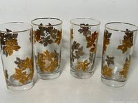 Four Libbey Golden Foliage tumblers front view
