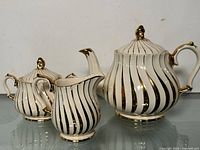 Teapot, creamer and sugar bowl front view