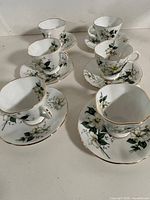 Six-piece Windsor Canadian Dogwood teacup and saucer set displayed