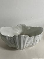 overall view of white porcelain clam shell bowl front side