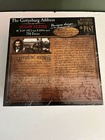 Front of sealed Gettysburg Address jigsaw puzzle showing artwork and branding