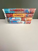 Stack of four An American Tail VHS tapes showing spines