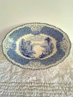 Full view of oval blue and white scenic transferware platter