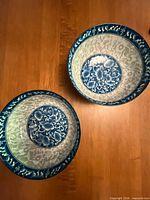 Top view showing blue and white floral interior of both bowls