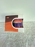 Boxed Dune mug front view showing sunset graphic through cut-out