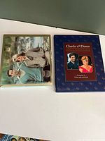 Two hardcover photo books side by side showing covers