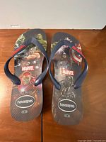 Top view of both flip flops showing Marvel Avengers graphics and straps